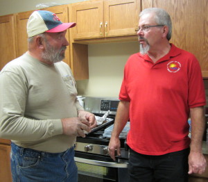 Rippey mayor Dan Brubaker talks with Friend of Rippey member Kevin Hick (right)