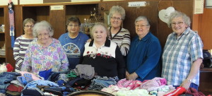 Members of the canasta-playing, rummage-selling Grand Junction Women's Club include (from left) Marilyn Paxton, Betty Grundon, Alma Collins, Viola Brown, Shirley Herrick, Marie Moran and Alice Fritz. They're raising funds for appliances for the new Grand Junction community center.