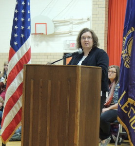 Principal Annie Smith reminds students to listen to veterans' stories.