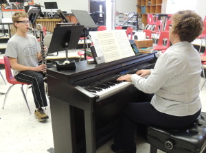 Greene County High School freshman Noah Von Stein gets some one-on-one time working on his bass clarinet solo with band director Becky Greiner