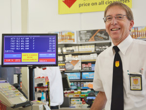 Fareway manager Doug Monaghan stands by the checkout screen that registered Tammy Smith’s two-minute dash for groceries. She grabbed $1,090.16 in meat products.