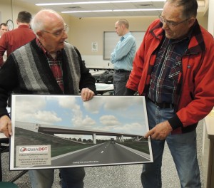 Bob Owens (left) and Bob Ausberger talk about a designer's rendering of the new overpass.