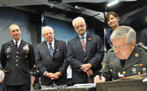 At the bill signing, (from left) Iowa National Guard Major Gen Timothy Orr, Bob Meyers, Leonard Boswell, Lt Gov Kim Reynolds and Gov Branstad. Photo by Iowa Governor's Office
