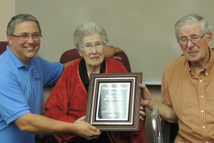 Genesis board president Phillip Nelson honors Helen and Curly Eason