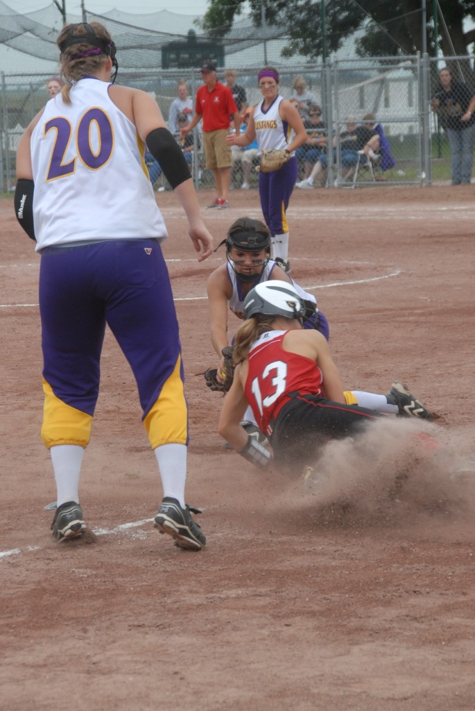 Emma Saddoris tries to slide under the tag but is called out.  photo by Mike Ketelsen, Ketelsen Photography