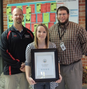 Brian Phillips, Emily Gannon, Kyle Kinne with the certificate