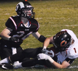 Jordan Challen releases the Tiger ball carrier after making the tackle  | Scranton Journal photo