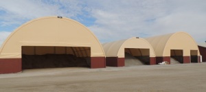 Sand and salt are stored in hoop buildings near the county shed in Jefferson