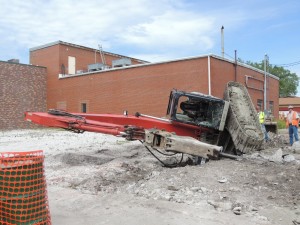 Backhoe on its side