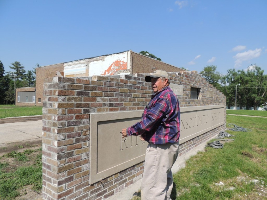 Keith Devilbiss learned masonry as a young man helping build the Rippey school. Last summer he used original brick and the building nameplate to create a memorial permanently marking the school site.