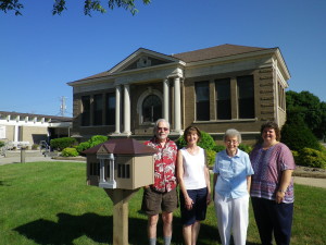 With the Little Free Library are (from left) Jim Rose, Barb Labate, Joyce Turner and Jane Millard