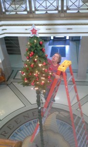 Courthouse custodians Amy Chapman (pictured) and Mike Wyatt erected the Christmas tree in the courthouse rotunda Monday.