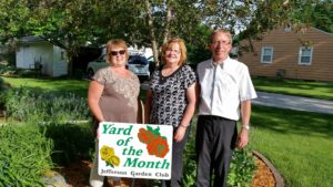 Garden Club member Darla Johnson (left) congratulates LeAnn and Doug Monaghan