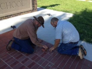 Mark and J.D. Devilbiss laying bricks.  | photo by Cindy Devilbiss