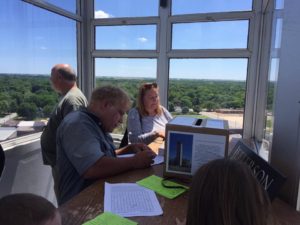 Visitors to the bell tower jot their memories