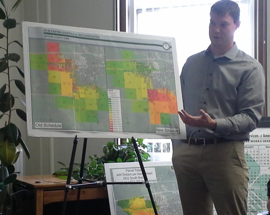 Jacob Hagen explains the proposed new classification schedule. Owners of property colored orange or red pay more than those of property colored green or yellow.