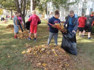 Middle school students raked at homes near the school