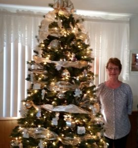 Jeanette Flack displays Precious Moments ornaments on one of five trees in her home.